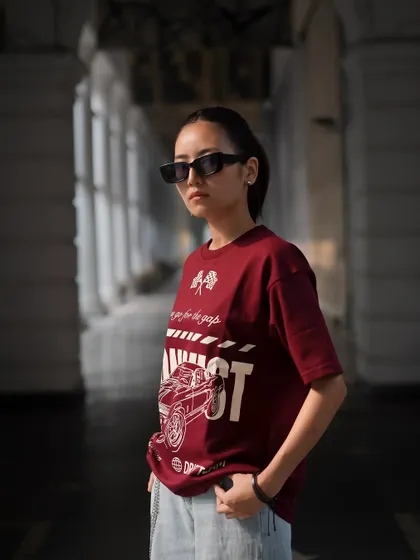 Using the shadows and light of the corridor, this shot creates a moodier feel. It highlights the t-shirt's design while giving the image an atmospheric, urban quality.