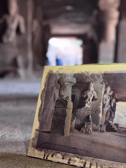 The finished artwork resting against the cave floor. This perspective shows the connection between the painting and its real life inspiration.