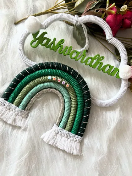 An angled shot of the 'Yashwardhan' piece, highlighting the texture of the macrame and the custom green name.