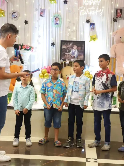 Lining up the kids for a team game. I organize activities that encourage teamwork and friendly competition, making sure everyone feels like a winner.