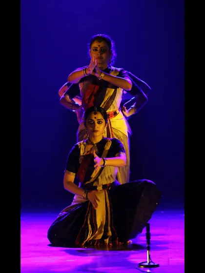 A powerful formation from 'Ikshana' showcasing the use of symmetry and levels in my ensemble choreography. The lighting and composition are integral to the storytelling, creating a distinct mood for each segment of the production.