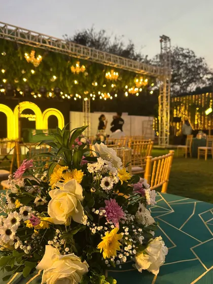 A close-up of the beautiful decor at a wedding cocktail night. It's all in the details, from the flowers to the playlist.