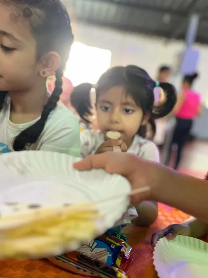 A little one enjoying a snack. Our parties are a time for everyone to relax and have fun together.