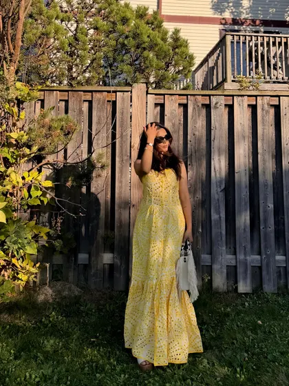 Featuring a beautiful yellow eyelet maxi dress from Jardinvue, perfect for a golden hour photoshoot.