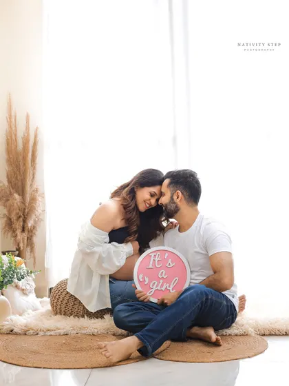 A beautiful and intimate gender reveal for a baby girl. The couple's loving embrace and the soft lighting create a very tender moment.