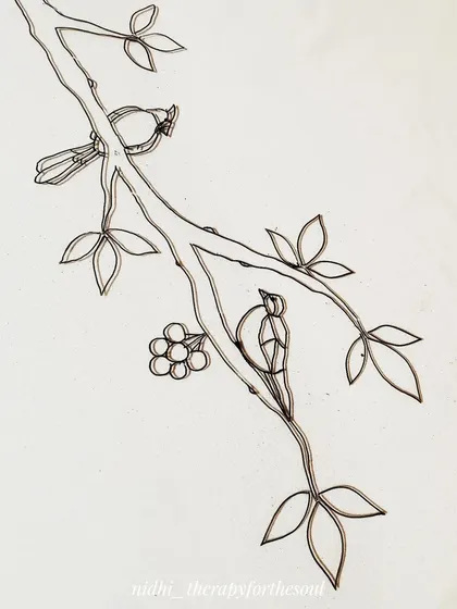 The initial black outline for a section of the large 'Birds and Branches' glass painting. This is the first step before the colors are carefully filled in.