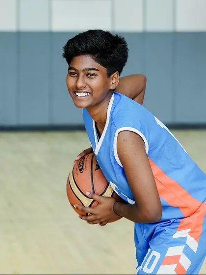 A smile that says it all. We make sure our young players enjoy every moment on the court.