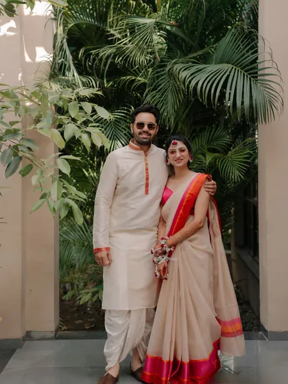 A Modern Fusion Haldi: This couple, obsessed with South Indian traditions, blended a Gujarati dhoti-kurta with a classic pattu saree for a unique, clean, and simple look.