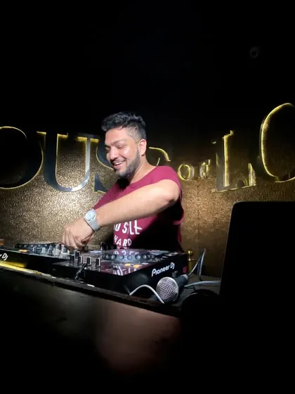 In my favorite place, on the decks at House of Lords. This is where I feel most at home, surrounded by music and good energy.