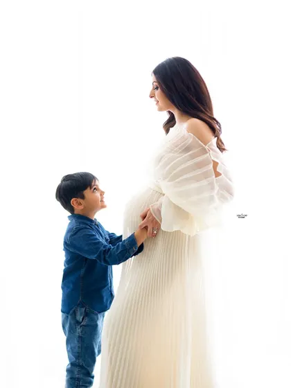 A tender moment between a mamma and her son. The way he looks up at her is just priceless.
