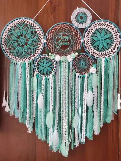 Our mint green cluster dreamcatcher, personalized with the name 'Anay', is designed to transform any room into a haven of peace. The combination of crochet and woven webs adds texture and detail.