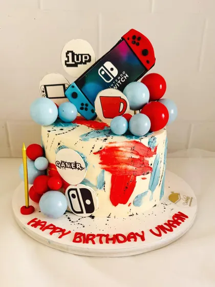 A fun and colorful Nintendo Switch cake for a gamer's birthday.