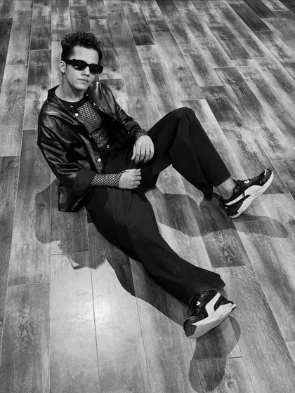 A relaxed, seated pose in my performance outfit. This shows a different, cooler side to the high-energy look.