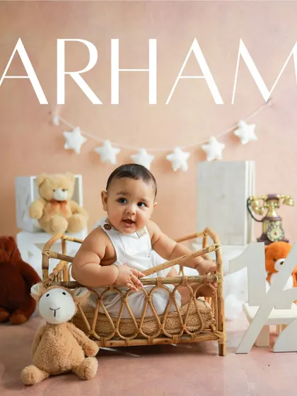 A half-birthday celebration with a teddy bear theme. The soft, warm tones and cuddly friends create a cozy and dreamy atmosphere for this little one's milestone portrait.