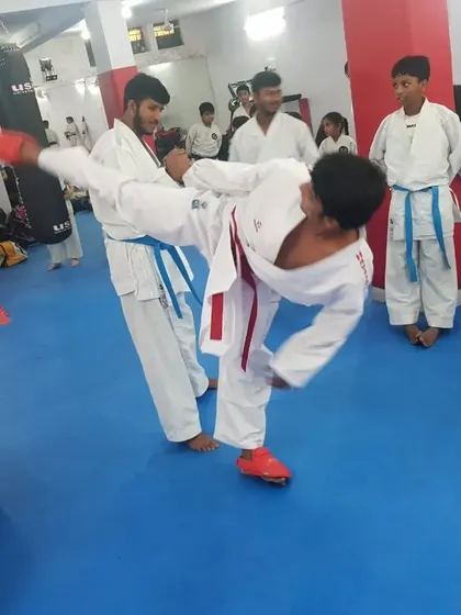 A student executes a powerful kick during a drill at the seminar, putting new learnings into practice.