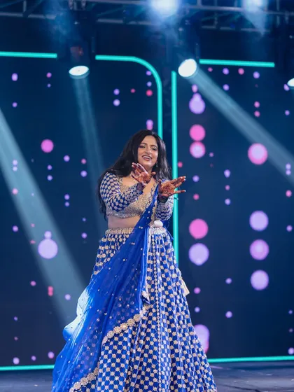This bride lit up the stage with her solo performance. Her energy was contagious, and she had the entire audience cheering for her.