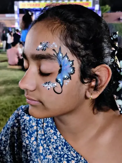 A beautiful blue butterfly design with a trail of sparkling silver glitter.
