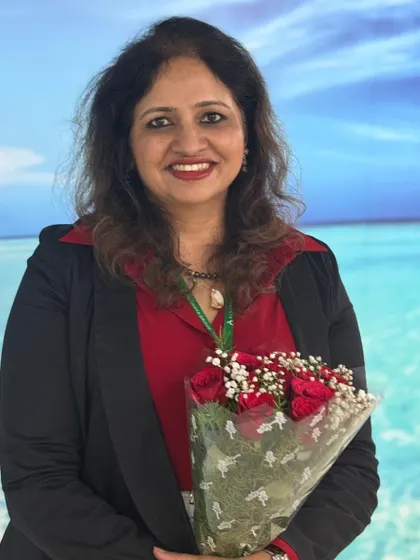 A photo of me after speaking at the "Radiant Her" event. It was an honor to share my expertise on skincare and women's well-being, empowering the attendees with knowledge to prioritize their health.