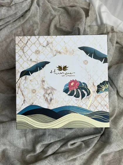 The exterior of one of our premium Diwali gift boxes. The design features a beautiful blend of marble texture and tropical leaf motifs, making the box a keepsake in itself.