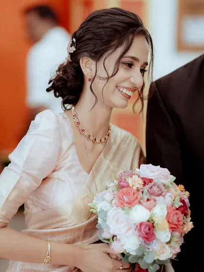 A candid shot of the Christian bride, her genuine laugh captured as she walks with her groom.