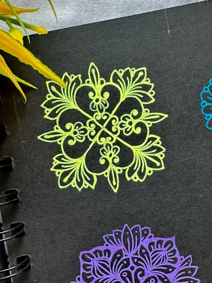 A beautiful floral-style mini mandala in a glowing yellow-green.