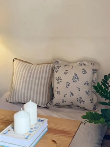 A simple yet elegant pairing of our striped and floral linen cushion covers. Placed on a daybed with some candles, they create a perfect spot for relaxation.