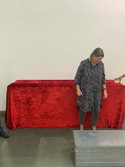 Clare Arni and the team setting up the prop tables for her interactive exhibition.