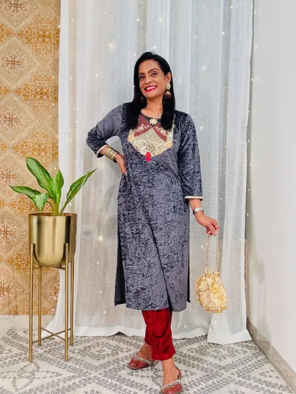 A grey velvet kurta with beautiful embroidery. This is a subtle and elegant option for a winter party or family gathering.