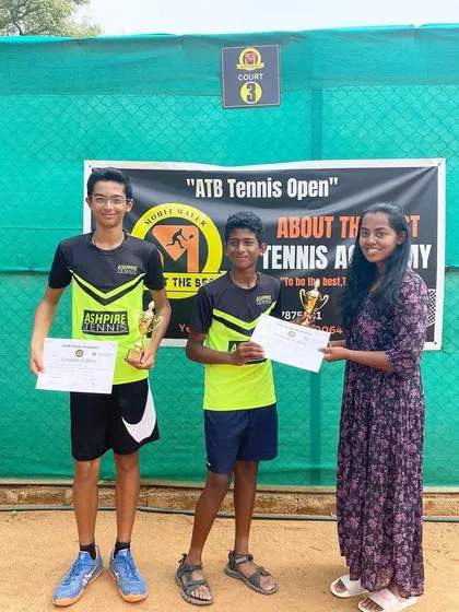 The boys' doubles finalists receiving their trophies.