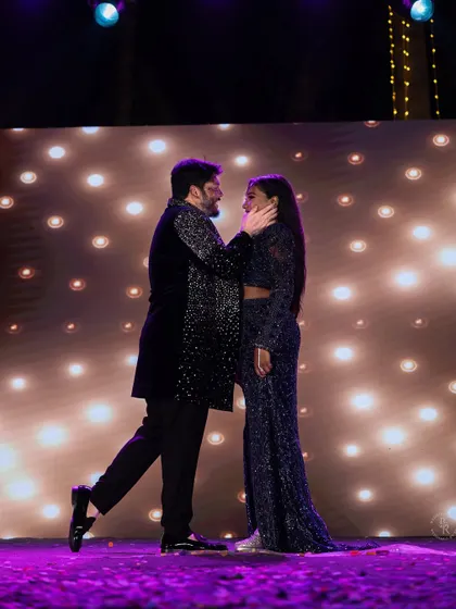 A tender moment on the Sangeet stage, as the couple shares a slow dance under the spotlight.