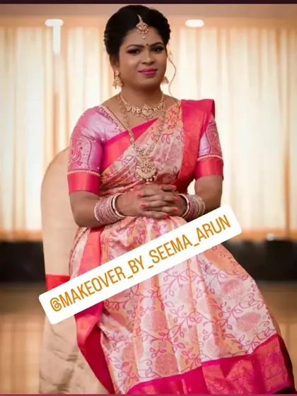 A full-length portrait of a bride at her engagement. I focus on perfect saree draping to ensure the pleats are neat and the pallu falls gracefully, allowing for comfortable seating and movement.