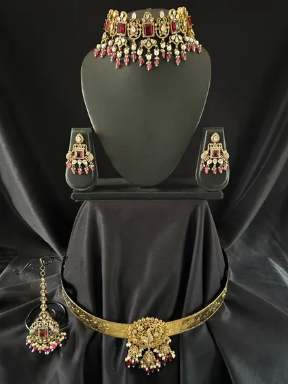 Just the choker, earrings, and maang tikka from the red Victorian set. You can rent parts of a set if you don't need the full bridal combo.