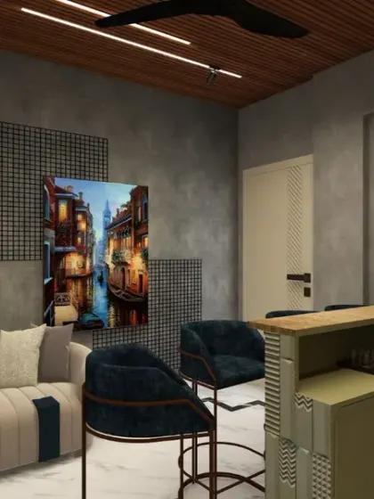 The lounge area adjacent to the bar features a comfortable sofa and vibrant art, creating a perfect space for relaxing with a drink.