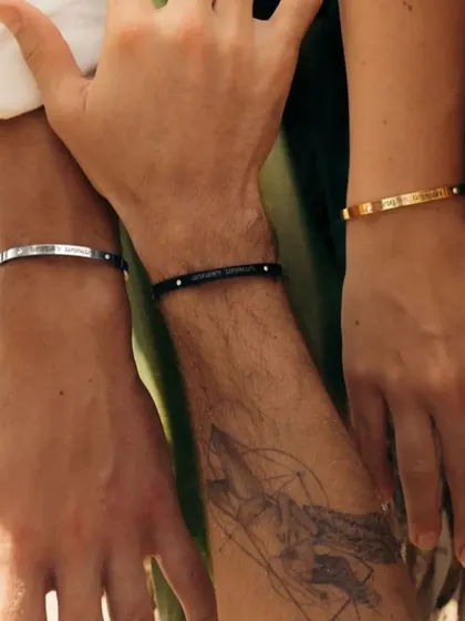 Showcasing the versatility of my bracelets for everyone. Here you can see three different wrists wearing our adjustable cuffs in Silver, Black, and Gold finishes, proving they are truly unisex.