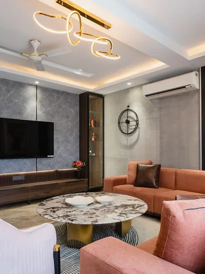 This angle shows the L-shaped sofa and how it creates a cozy corner for conversation. The combination of different textures keeps the design interesting.