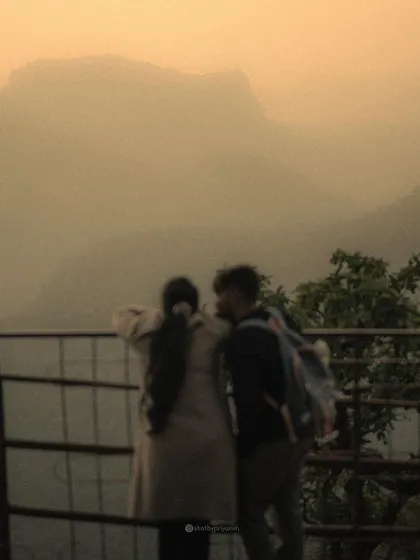 Sometimes a blurry photo captures the feeling just right. This moody, atmospheric shot of a couple looking out at the mountains is about the shared moment and the memories being made.