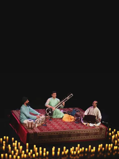 A wide shot of the stage in London, surrounded by candles.