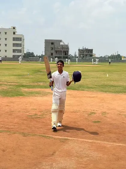 Celebrating a fantastic century on the field. Manan Goel acknowledges the applause after reaching a milestone, a moment of pure joy and accomplishment that we strive for with every player.