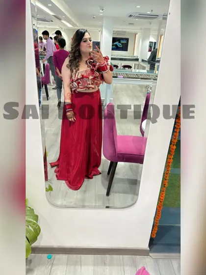 A Karwa Chauth queen in a beautiful red co-ord set with a 3D floral top. This is a modern and stylish choice for the festival.