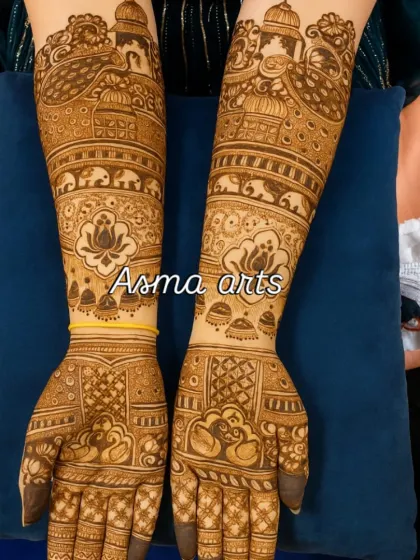 This traditional bridal henna design features classic motifs like the doli, elephants, and lotus flowers. Each element is a symbol of beauty, prosperity, and the new journey the bride is embarking on.