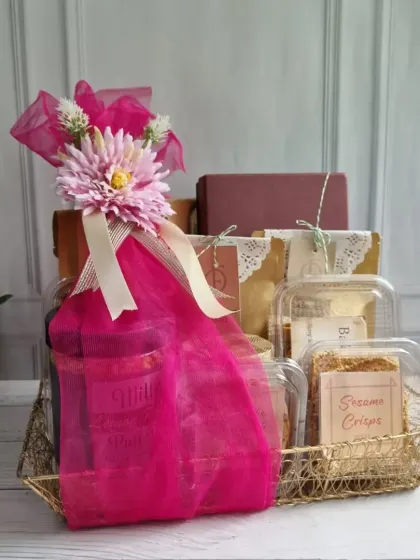 Elevate your business relationships with thoughtful corporate gifting. This vibrant pink hamper is filled with our gourmet snacks and makes for a memorable gesture for clients and partners.