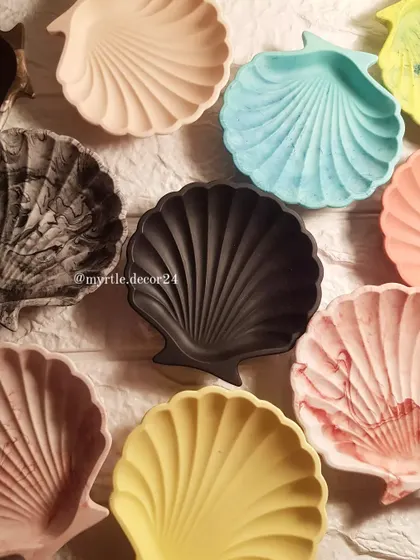 A gathering of our shell dishes, showing the beautiful range of colors and finishes we offer. From soft pastels to bold solids and unique marble effects, we can create a piece that feels just right for your space.