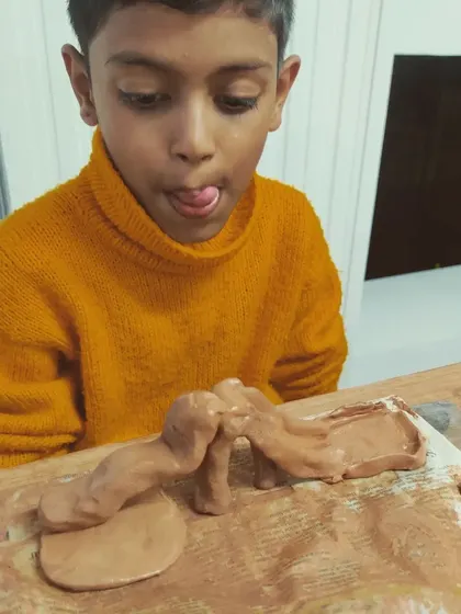 The pure concentration of a child at work is a lesson in mindfulness. My studio is a space for these "Muddy Puddles" moments, where kids can have a creative outlet and just be themselves.