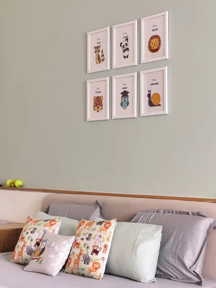 Another view of the kid's bed in 'A Walk in the Clouds', with cute animal art prints on the wall, adding a playful touch to the serene space.