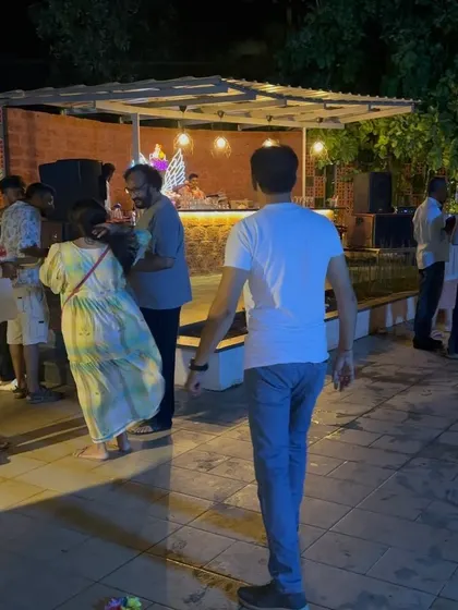 A candid shot of guests enjoying the DJ music at night. Our outdoor patio transforms into a dance floor where your team can unwind and have a great time.