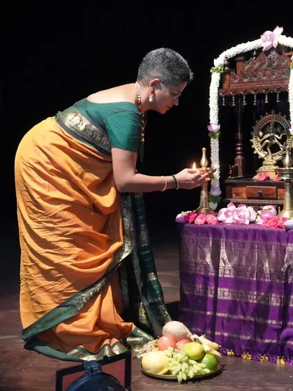 Beginning every performance with a prayer. Here I am, lighting the lamp before my student's recital, seeking blessings from the divine for a successful performance.