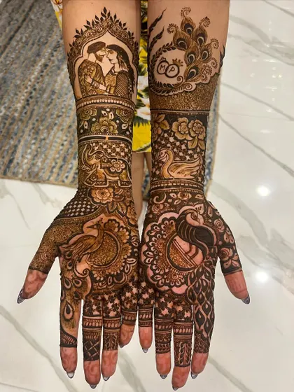 Your mehendi can be your love story. For this bride, I wove in portraits, wedding rings, and beautiful peacocks, creating a full bridal design that was deeply personal and traditional.