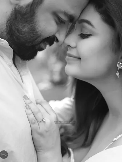 A quiet, gentle moment between the couple. The black and white treatment emphasizes the soft light and the peaceful expressions.