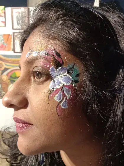 A beautiful purple and white floral design with a background of soft colors and glitter. This shows how I can blend colors for a watercolor effect.