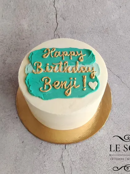 I love the turquoise and gold combination on this simple birthday cake. It's a half-kg Chocolate Caramel cake with a painted buttercream swipe and gold lettering.